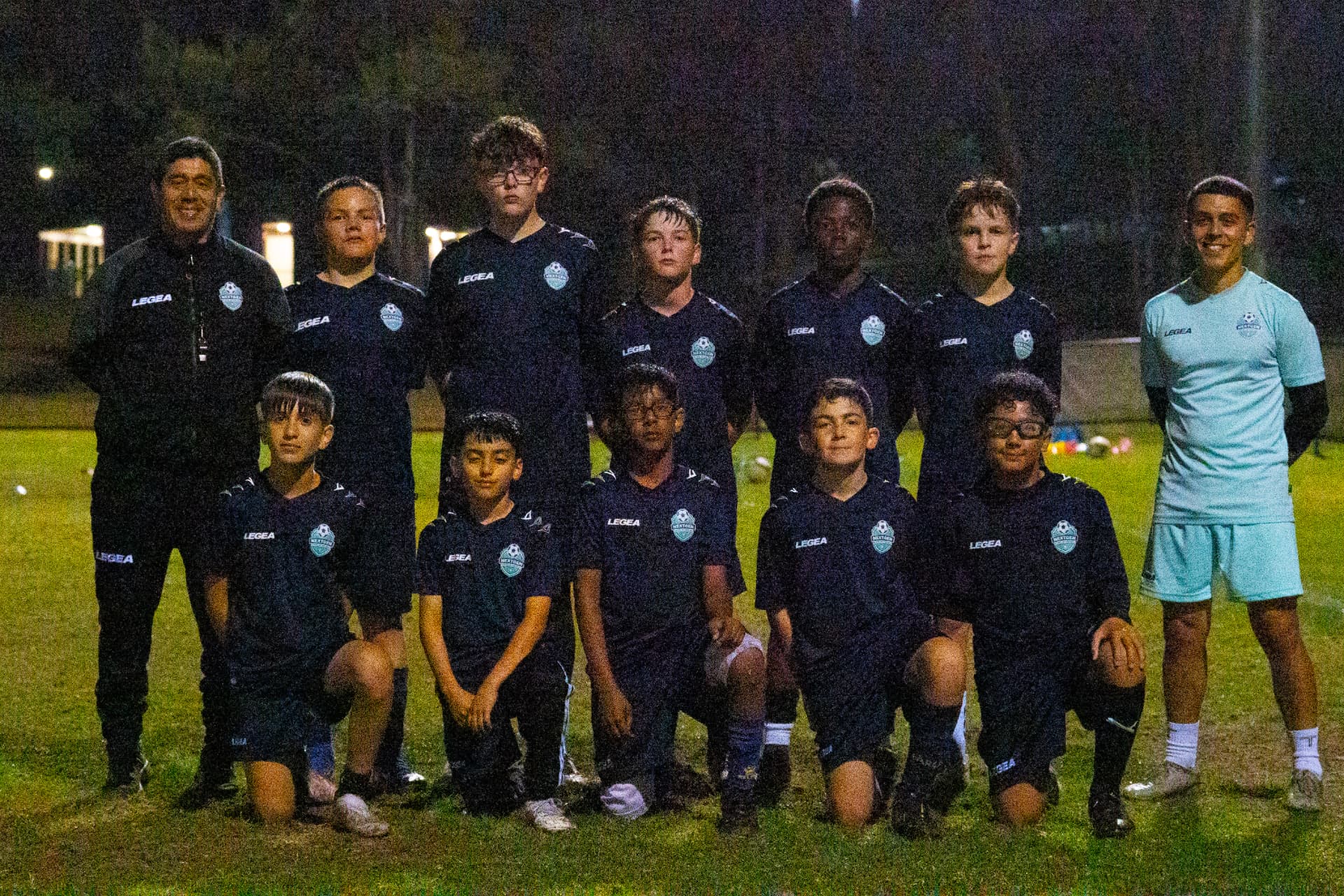 NextGen players and coaches together on the training pitch